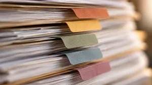Five colored dividers separating sections of a thick case bundle